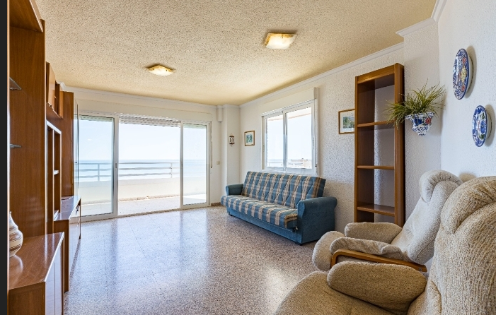 First line beach apartment with frontal sea view